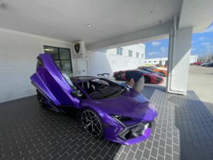 purple car with door open